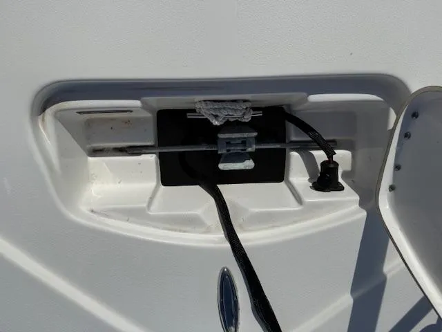Slide: The Image of 2021 Tidewater 2410 Bay Max boat cleat with rope and hardware. - 35