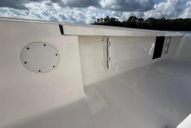 Slide: The Image of 2021 Tidewater 2410 Bay Max boat interior with sleek white finish and hardware details. - 40