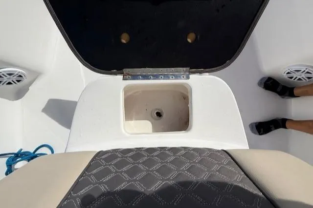 Slide: The Image of 2021 Tidewater 2410 Bay Max boat interior with open storage compartment. - 42
