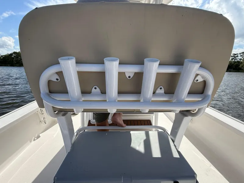 Slide: The Image of 2021 Tidewater 2410 Bay Max boat with rod holders and seating, on a sunny day. - 47