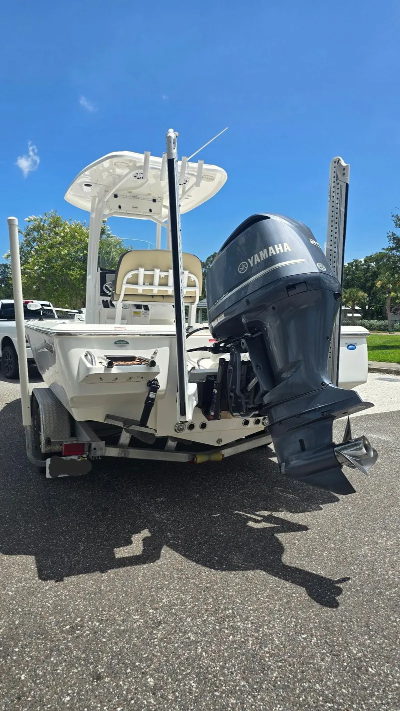 Slide: The Image of 2021 Tidewater 2410 Bay Max boat with Yamaha outboard motor on trailer, sunny day. - 53