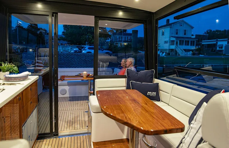 Slide: The Image of Luxurious interior of 2026 MJM 47R yacht with elegant seating and dining area. - 5