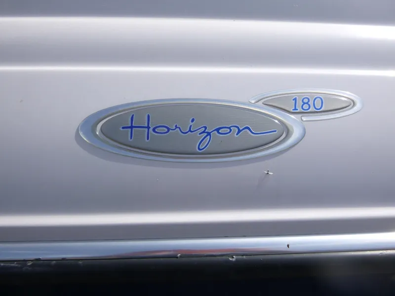 Slide: The Image of 2007 Four Winns 180 Horizon logo on boat exterior. - 16