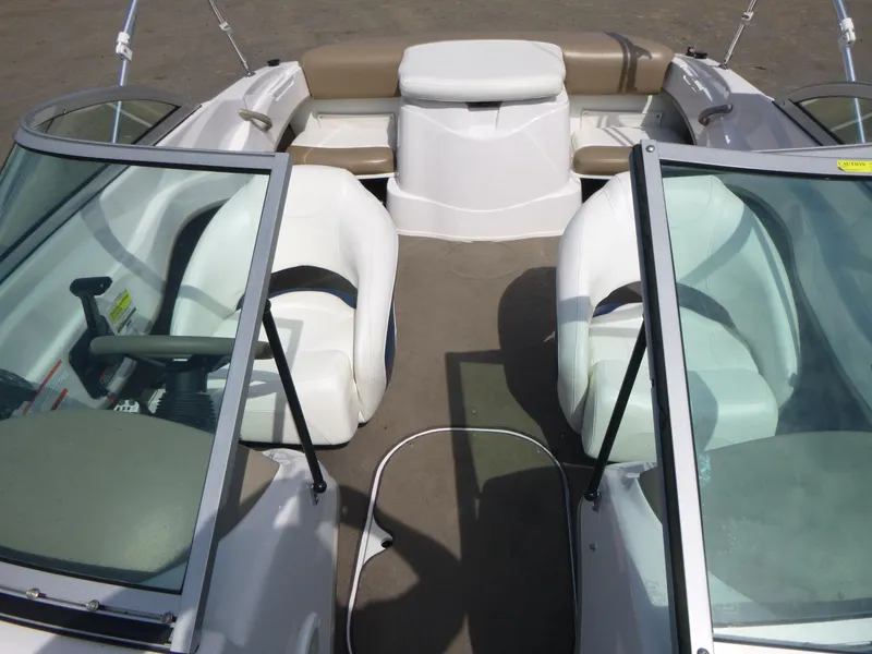 Slide: The Image of 2007 Four Winns 180 Horizon boat interior with white seating and windshield. - 6