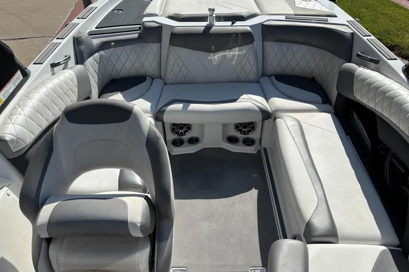 Slide: The Image of 2014 Tigé RZR boat interior with gray quilted seating and modern design. - 5