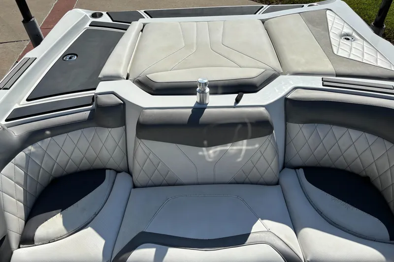 Slide: The Image of 2014 Tigé RZR boat interior with quilted gray and white seating. - 6