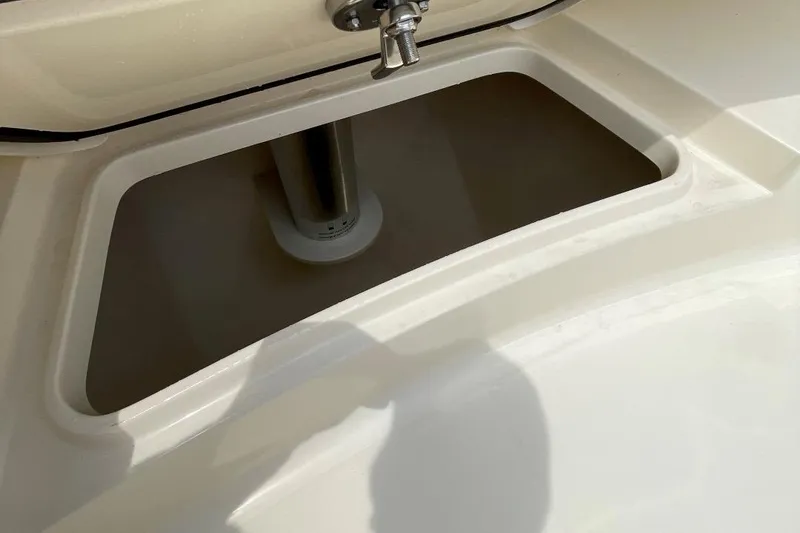 Slide: The Image of Storage compartment on a 2020 Scout 420 LXF boat, featuring a sleek design. - 12