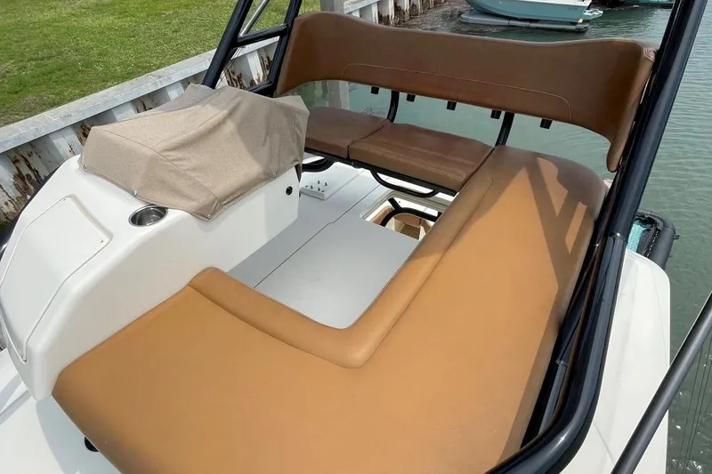 Slide: The Image of 2020 Scout 420 LXF boat interior with tan seating and sleek design. - 16