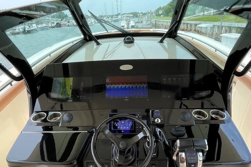 Slide: The Image of 2020 Scout 420 LXF boat dashboard with advanced navigation controls and displays. - 23