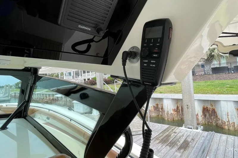 Slide: The Image of 2020 Scout 420 LXF boat interior with Garmin marine electronics and communication device. - 29