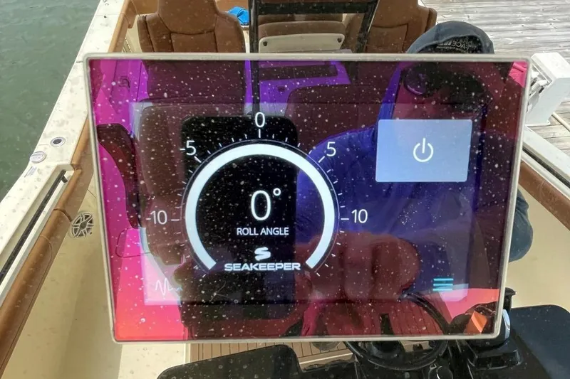 Slide: The Image of Display screen on 2020 Scout 420 LXF showing Seakeeper roll angle at zero degrees. - 30