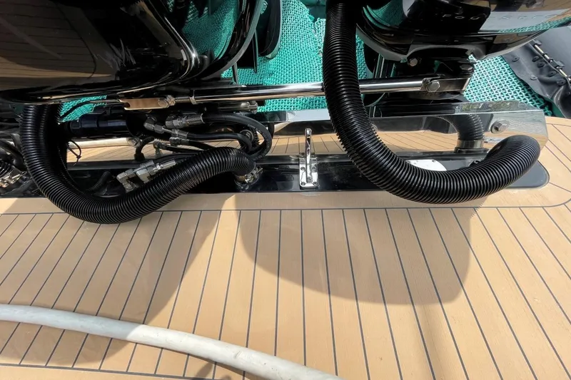 Slide: The Image of 2020 Scout 420 LXF boat deck with visible engine components and wiring. - 45