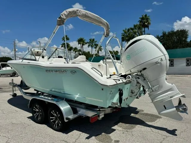 Slide: The Image of 2026 Key West 203 DFS boat on trailer, featuring Yamaha outboard motor, parked outdoors. - 3