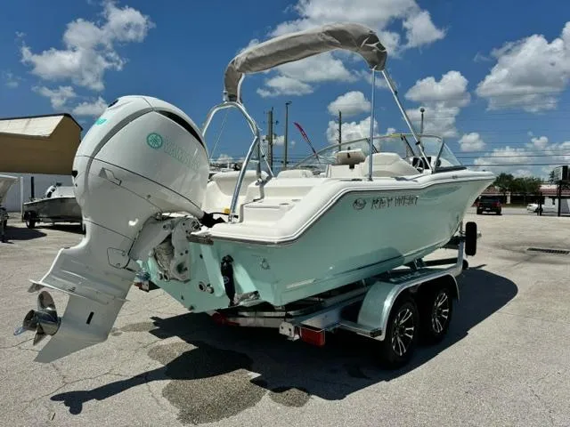 Slide: The Image of 2026 Key West 203 DFS boat on trailer under clear sky. - 5