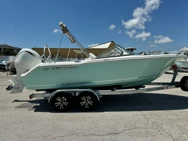 Slide: The Image of 2026 Key West 203 DFS boat on trailer under clear blue sky. - 6