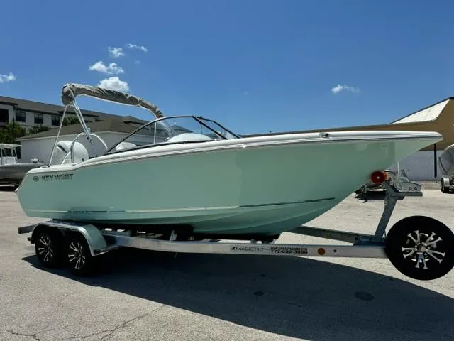 Slide: The Image of 2026 Key West 203 DFS boat on trailer under clear blue sky. - 7