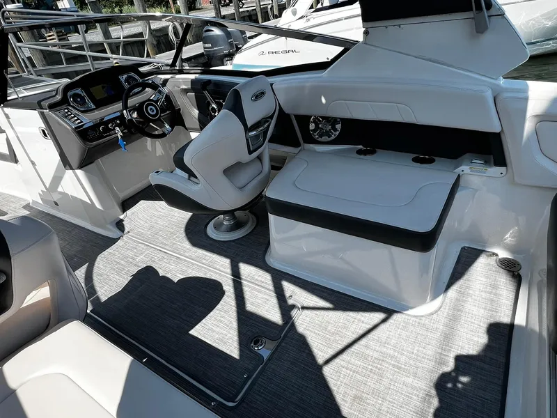 Slide: The Image of 2018 Chaparral 257 SSX boat interior with modern dashboard and seating. - 12