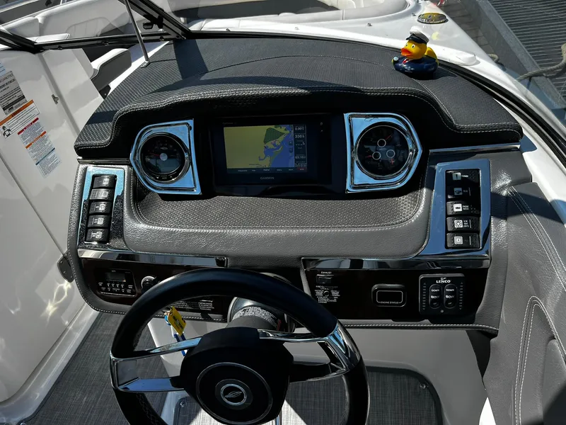 Slide: The Image of Dashboard of 2018 Chaparral 257 SSX boat with navigation system and rubber duck accessory. - 15