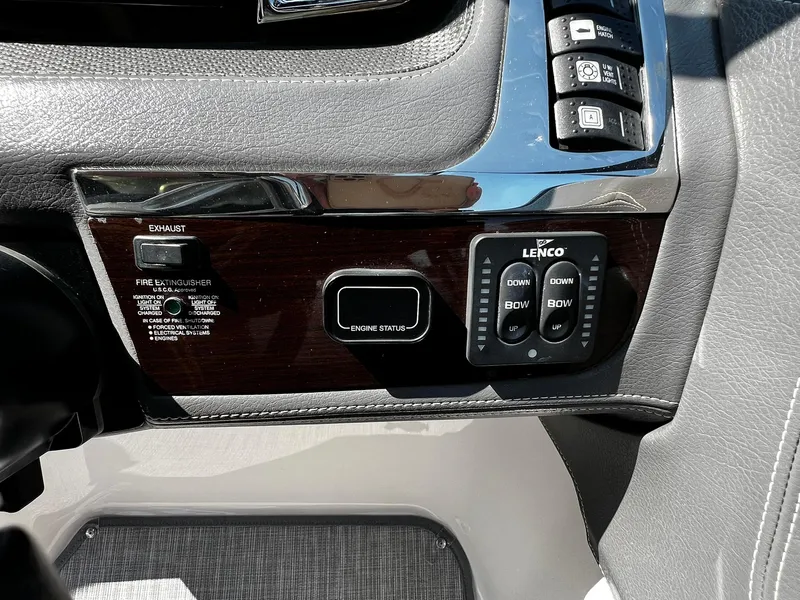 Slide: The Image of Control panel of a 2018 Chaparral 257 SSX boat with Lenco trim tab switches. - 16