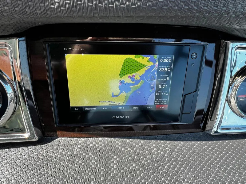 Slide: The Image of Garmin GPS display on 2018 Chaparral 257 SSX boat dashboard, showing navigation map. - 19