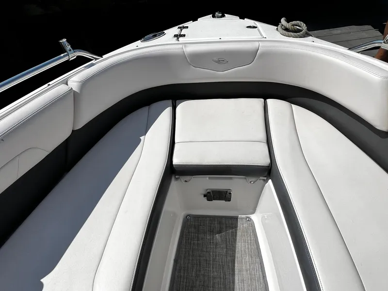 Slide: The Image of 2018 Chaparral 257 SSX boat interior with white cushioned seating and sleek design. - 27