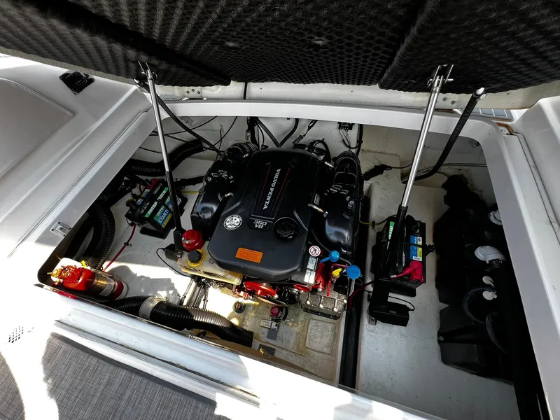 Slide: The Image of Engine compartment of 2018 Chaparral 257 SSX boat, featuring a Volvo Penta 350 V8 engine. - 33