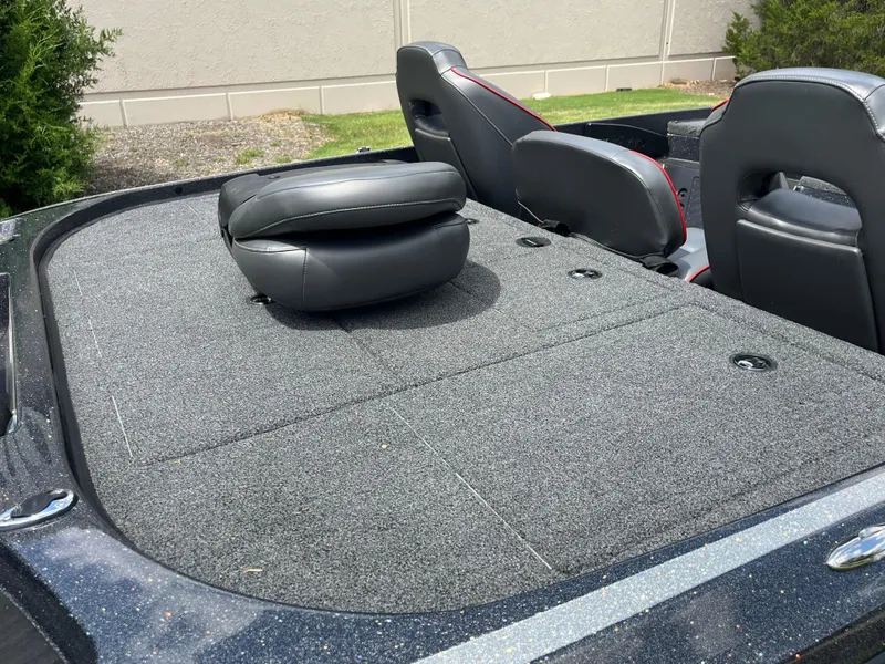 Slide: The Image of 2023 Nitro Z20 boat with Mercury Pro XS engine on grassy area. - 10