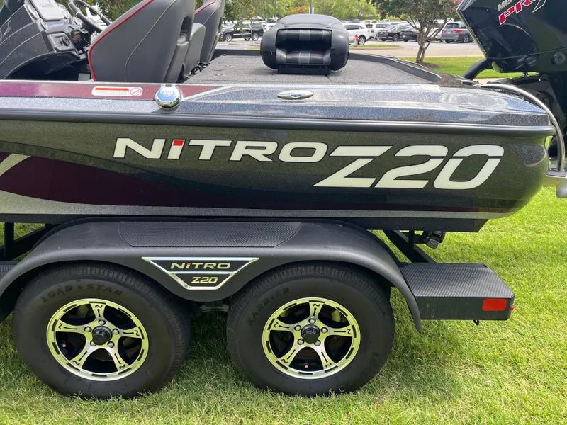 Slide: The Image of Interior of 2023 Nitro Z20 boat with sleek seating and modern dashboard design. - 13