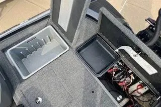 Slide: The Image of 2023 Nitro Z20 boat storage compartments and battery area, featuring organized layout and durable materials. - 23