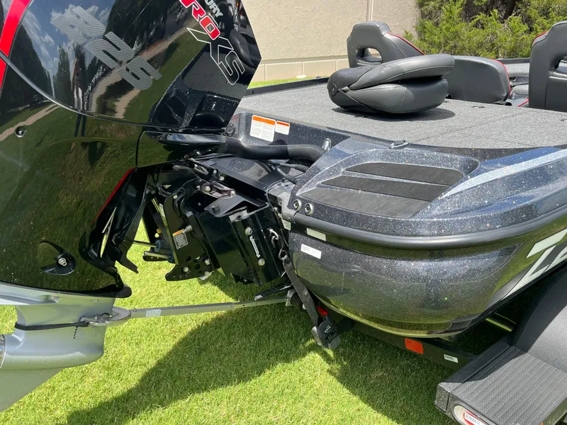 Slide: The Image of 2023 Nitro Z20 boat with Garmin equipment on trailer, parked on grass. - 3