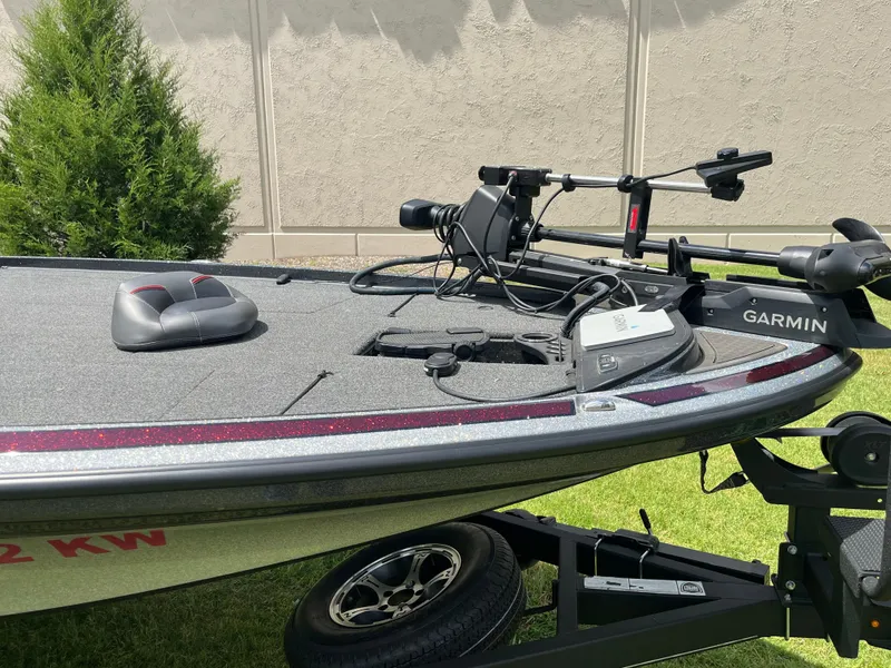 Slide: The Image of 2023 Nitro Z20 boat with sleek design, parked on grass near a building. - 4