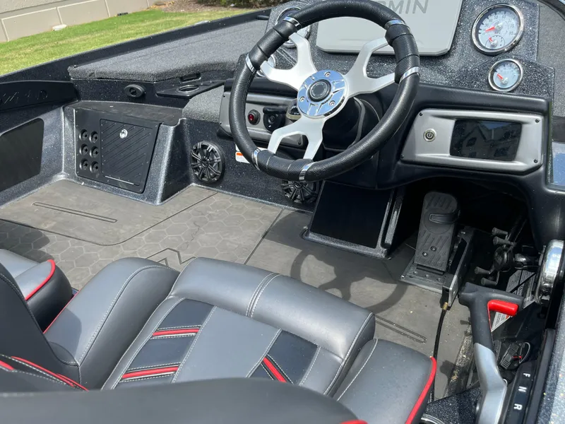 Slide: The Image of 2023 Nitro Z20 boat deck with cushioned seating and carpeted surface. - 9