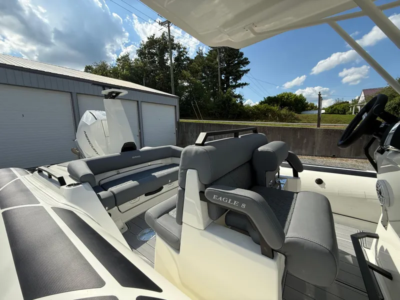 Slide: The Image of 2026 Brig Eagle 8 boat interior with gray seating and modern design. - 14