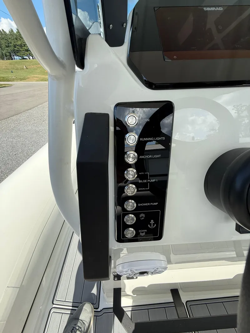 Slide: The Image of Control panel of 2026 Brig Eagle 8 boat with various switches and buttons. - 19