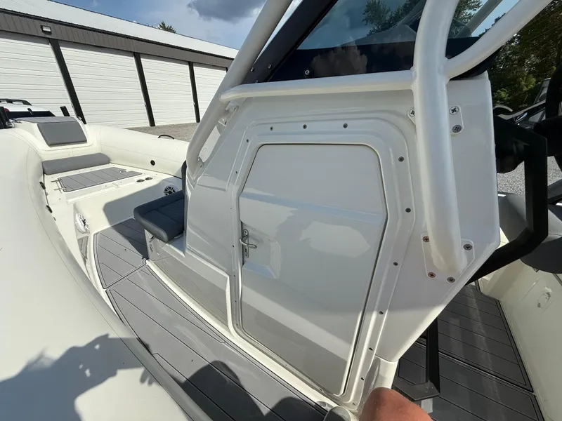 Slide: The Image of 2026 Brig Eagle 8 boat interior with seating and storage compartment. - 21