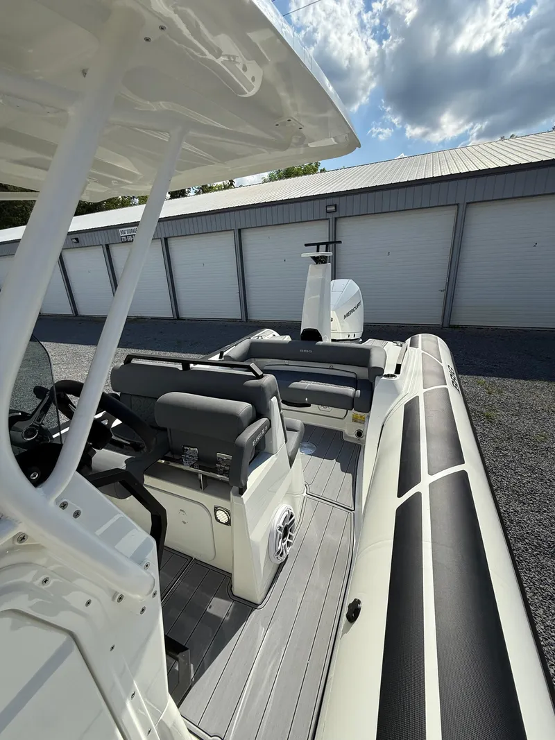 Slide: The Image of 2026 Brig Eagle 8 boat interior with seating, steering, and storage units. - 27