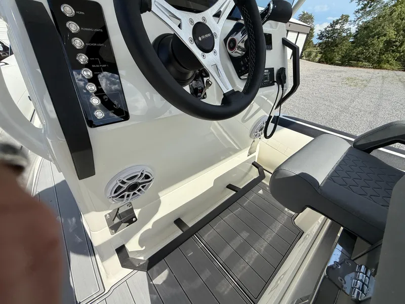 Slide: The Image of 2026 Brig Eagle 8 boat cockpit with steering wheel, control panel, and seating. - 30