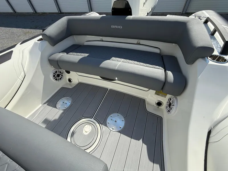 Slide: The Image of 2026 Brig Eagle 8 boat interior with gray seating and modern deck design. - 31