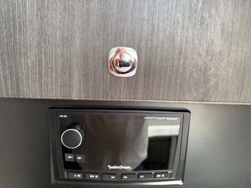 Slide: The Image of 2023 Formula 350 Crossover Bowrider I/O interior kitchenette with modern appliances and sleek design. - 15