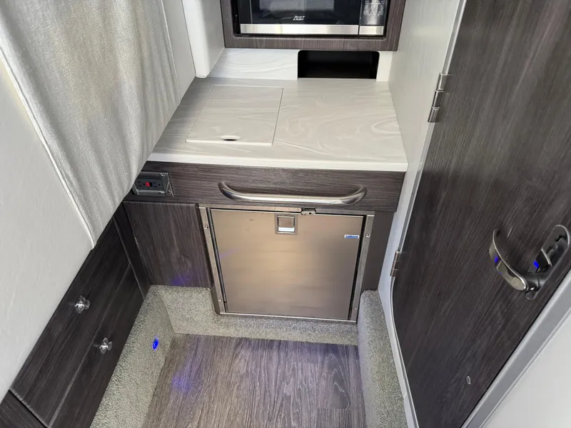 Slide: The Image of 2023 Formula 350 Crossover Bowrider I/O bathroom with modern fixtures and compact design. - 16