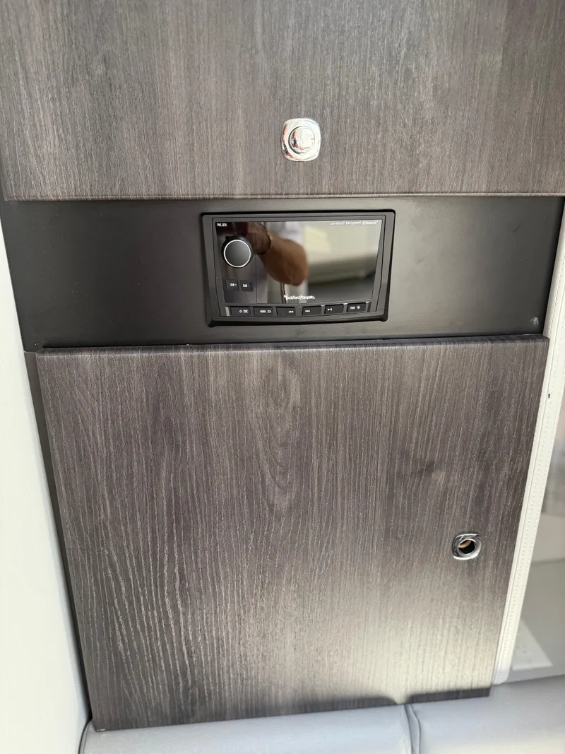 Slide: The Image of Twin V8 engines in a 2023 Formula 350 Crossover Bowrider I/O boat. - 18