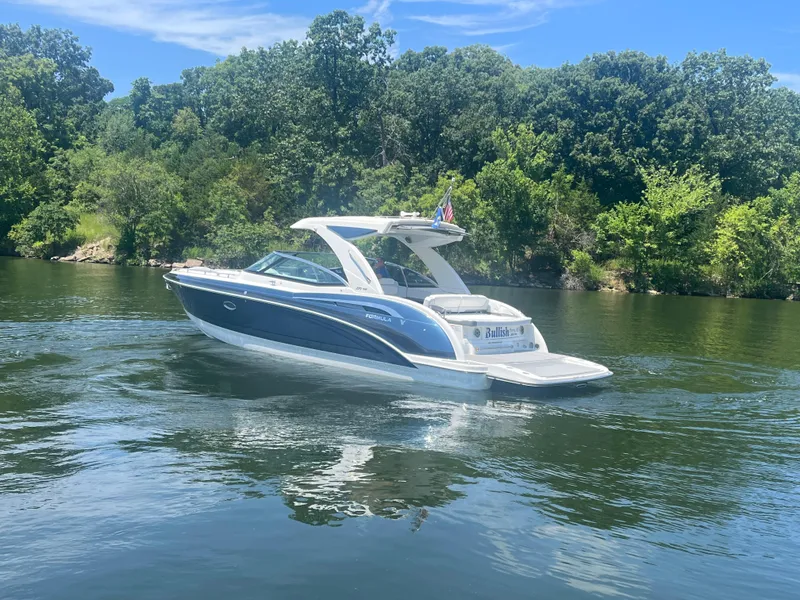 Slide: The Image of 2023 Formula 350 Crossover Bowrider I/O cruising on a scenic lake. - 29