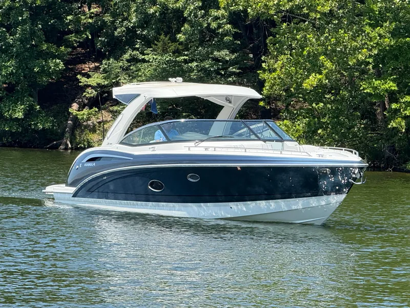 Slide: The Image of 2023 Formula 350 Crossover Bowrider I/O cruising on a serene lake. - 3