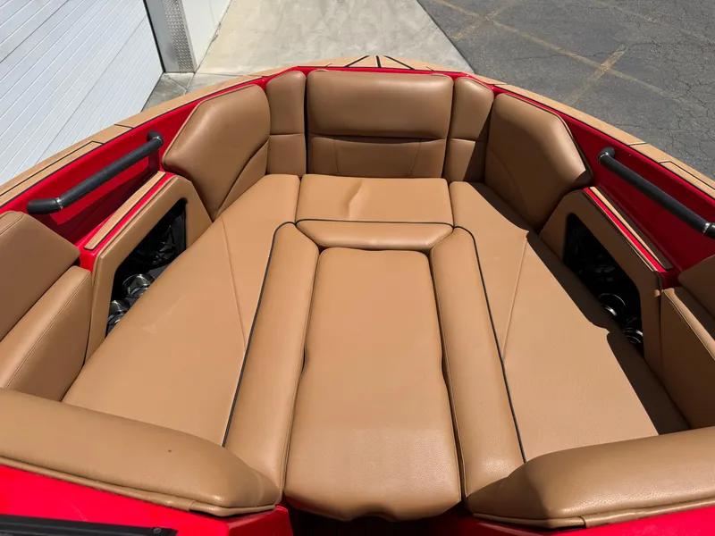 Slide: The Image of 2024 Moomba Craz boat interior with tan leather seating and red accents. - 5