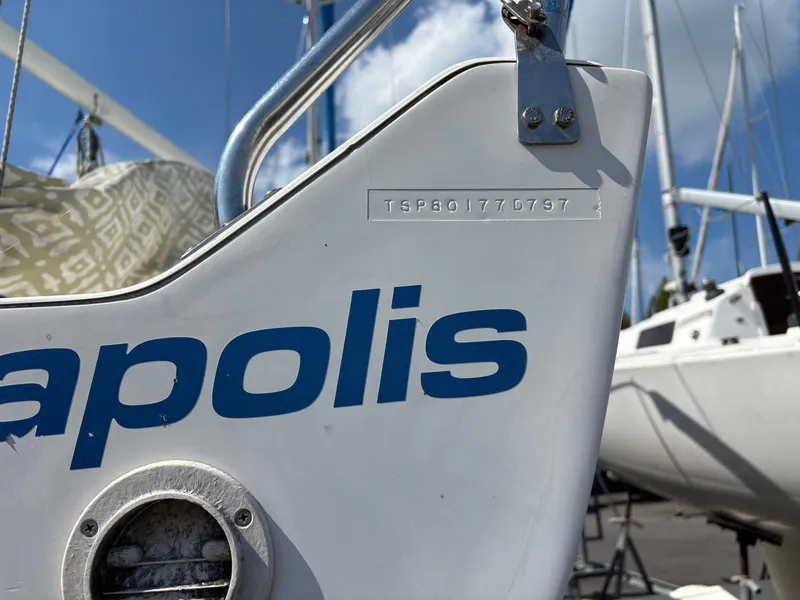 Slide: The Image of Close-up of a 1997 J Boats J/80 sailboat hull with visible serial number. - 12