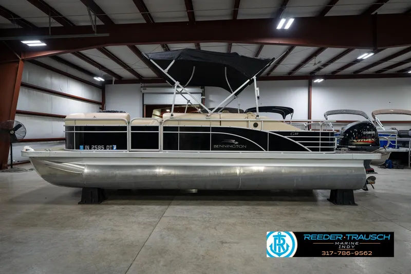Slide: The Image of 2014 Bennington 2275GCW pontoon boat with Yamaha engine in indoor storage. - 10