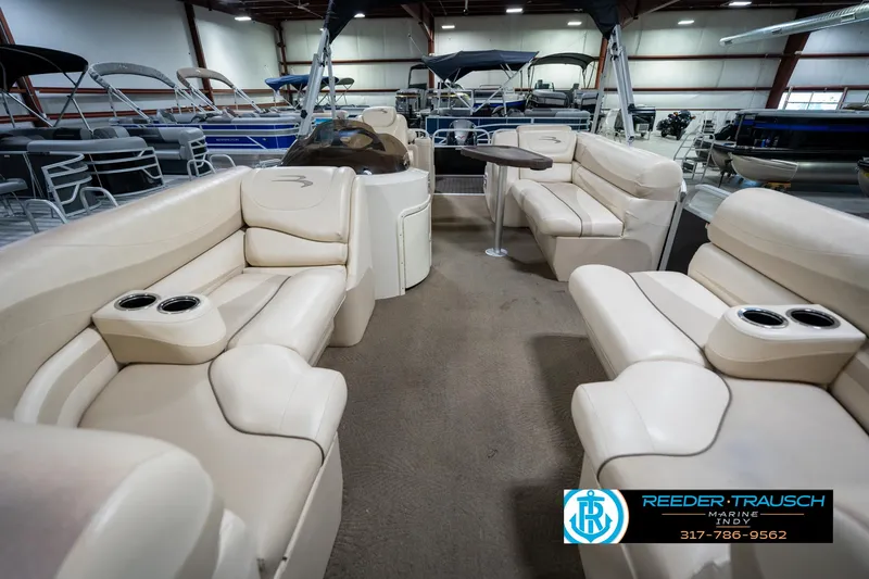 Slide: The Image of 2014 Bennington 2275GCW pontoon boat with luxurious seating and modern dashboard. - 15