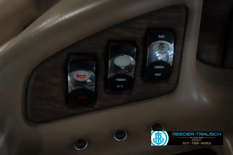 Slide: The Image of 2014 Bennington 2275GCW pontoon boat interior with beige seating in showroom. - 27