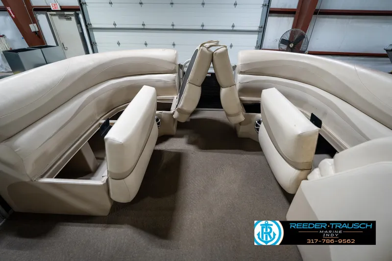 Slide: The Image of Steering wheel and dashboard of a 2014 Bennington 2275GCW boat with Garmin display. - 32