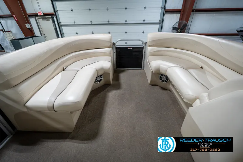 Slide: The Image of Steering console of a 2014 Bennington 2275GCW boat with wood accents and gauges. - 33
